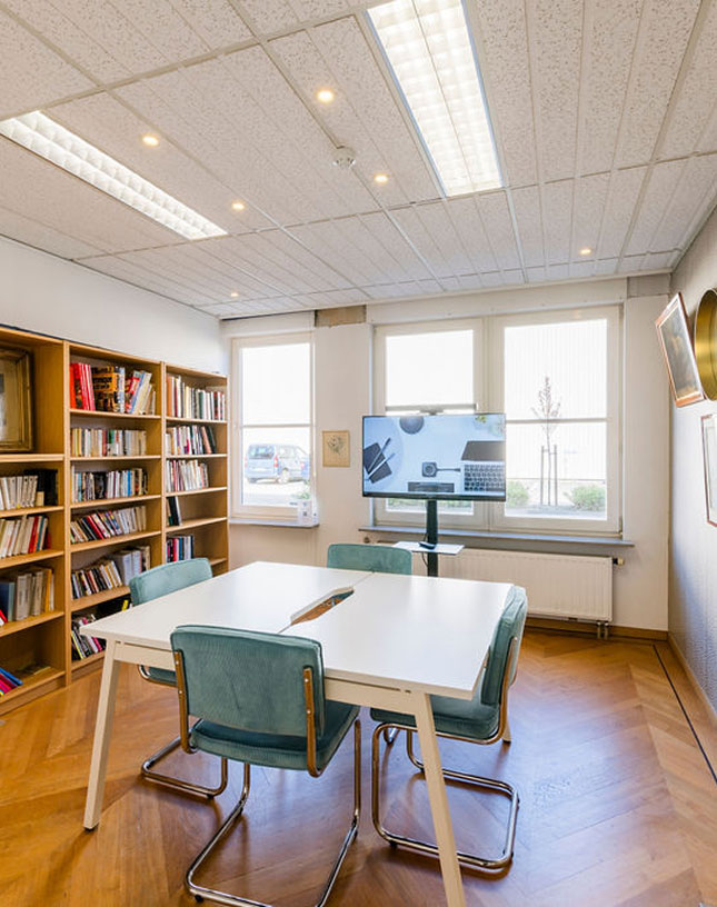 tables and 4 chairs by a library decoration