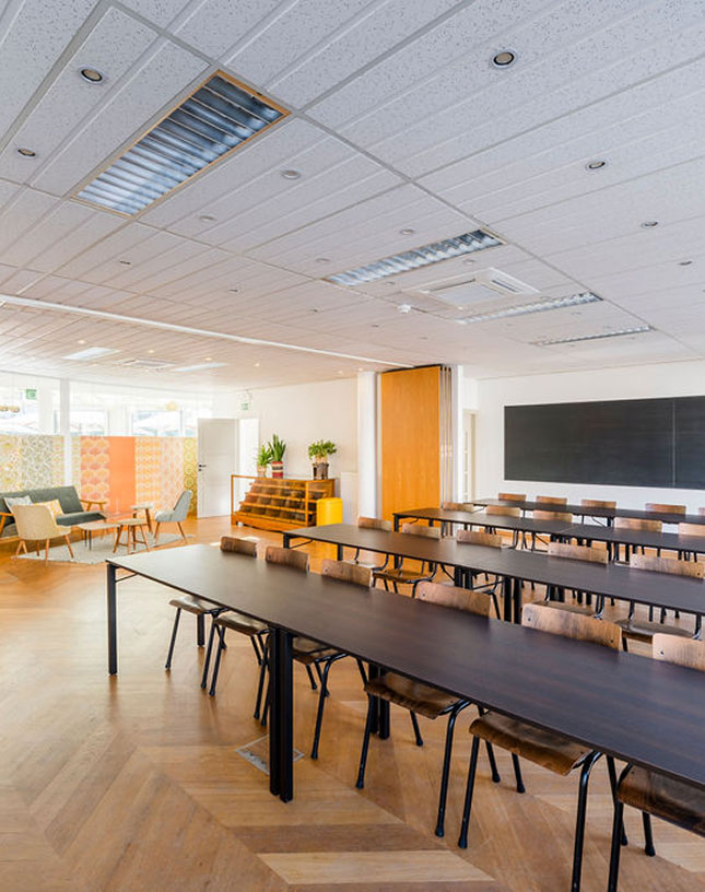 Spacious training room with wooden floor and modern furniture